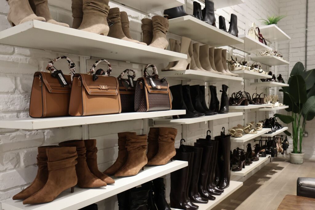 Autumn boots and bags on the shoe wall