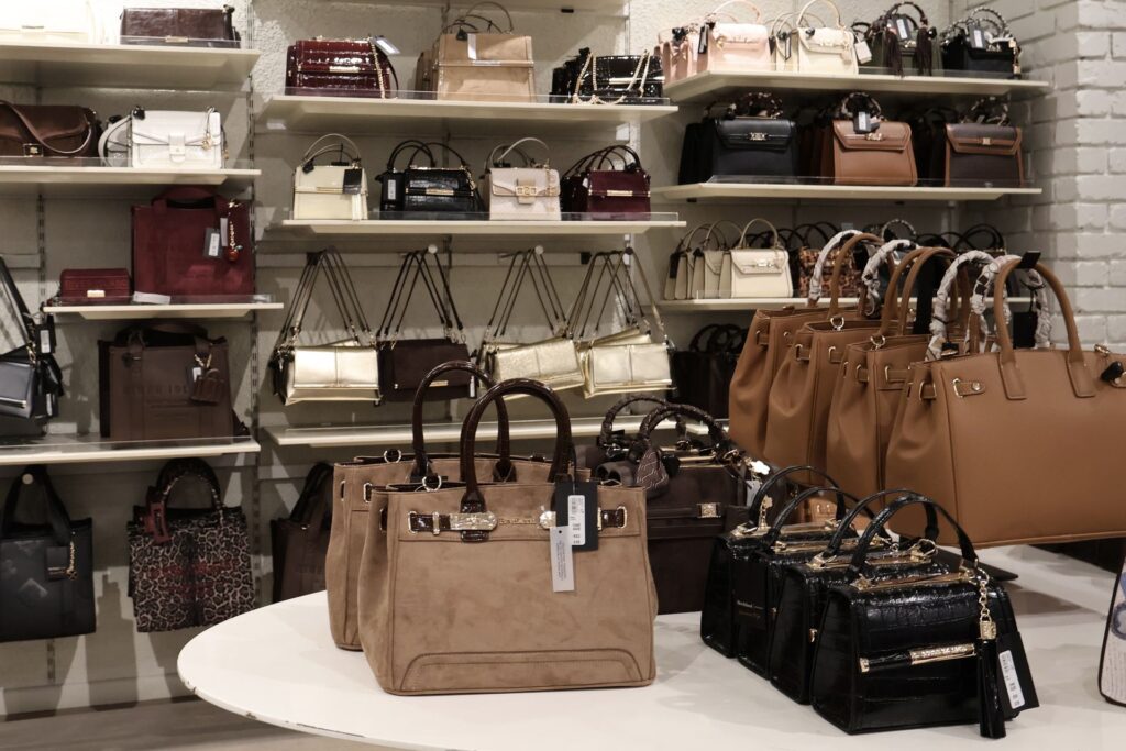 Handbags on display shelving