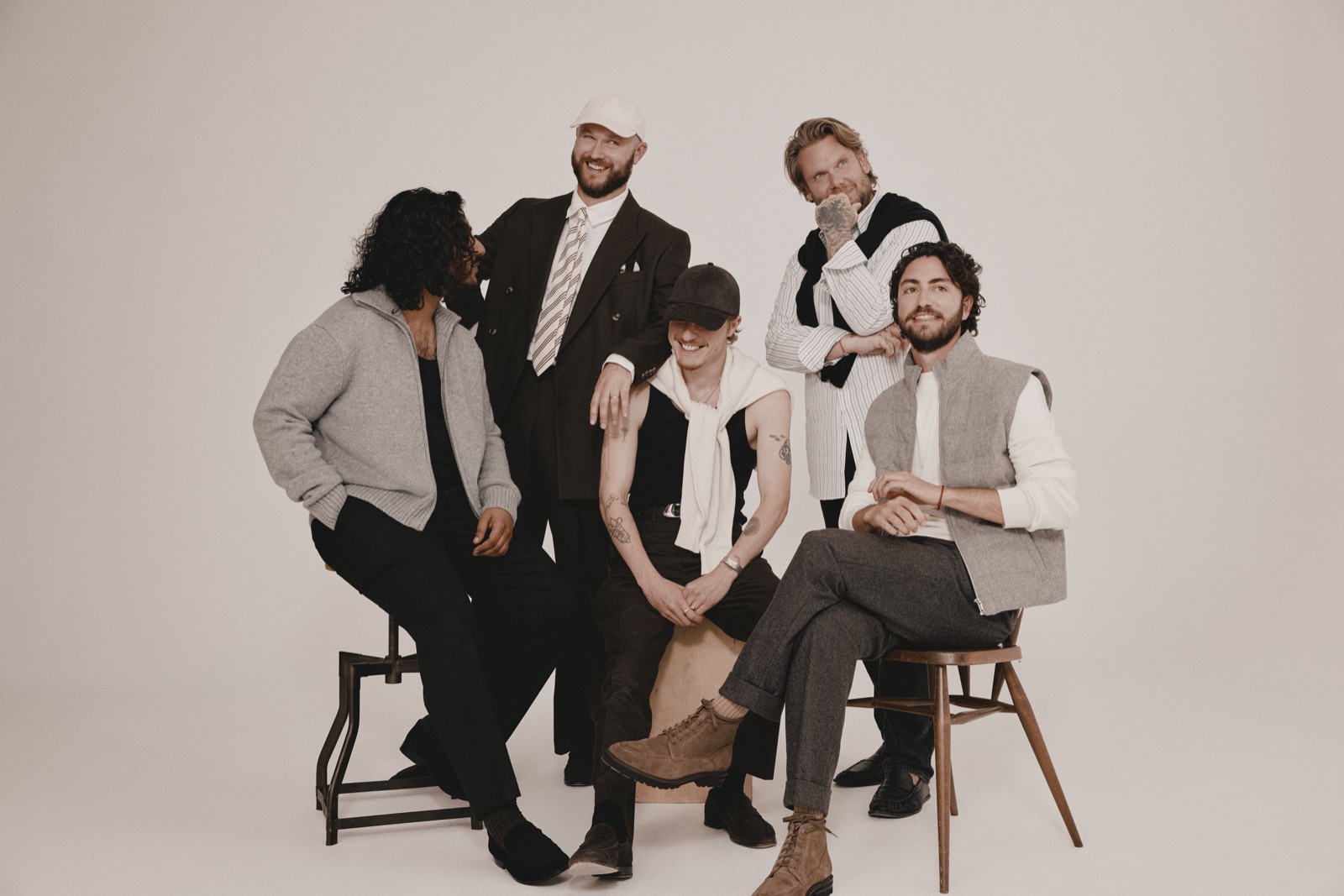 Moss Autumn Winter 26 In Good Company campaign, a group of friends in Moss tailoring